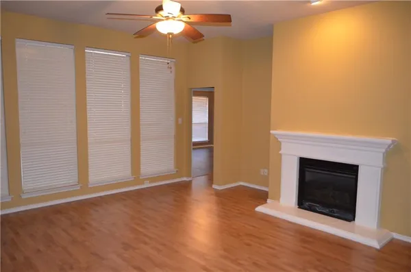 a kitchen with stainless steel appliances a refrigerator and a stove top oven