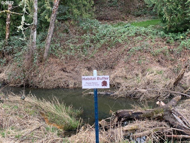 2426 South Brookside Place Ridgefield, WA 98642 - Photo 28 of 31 a sign that is on the side of a road