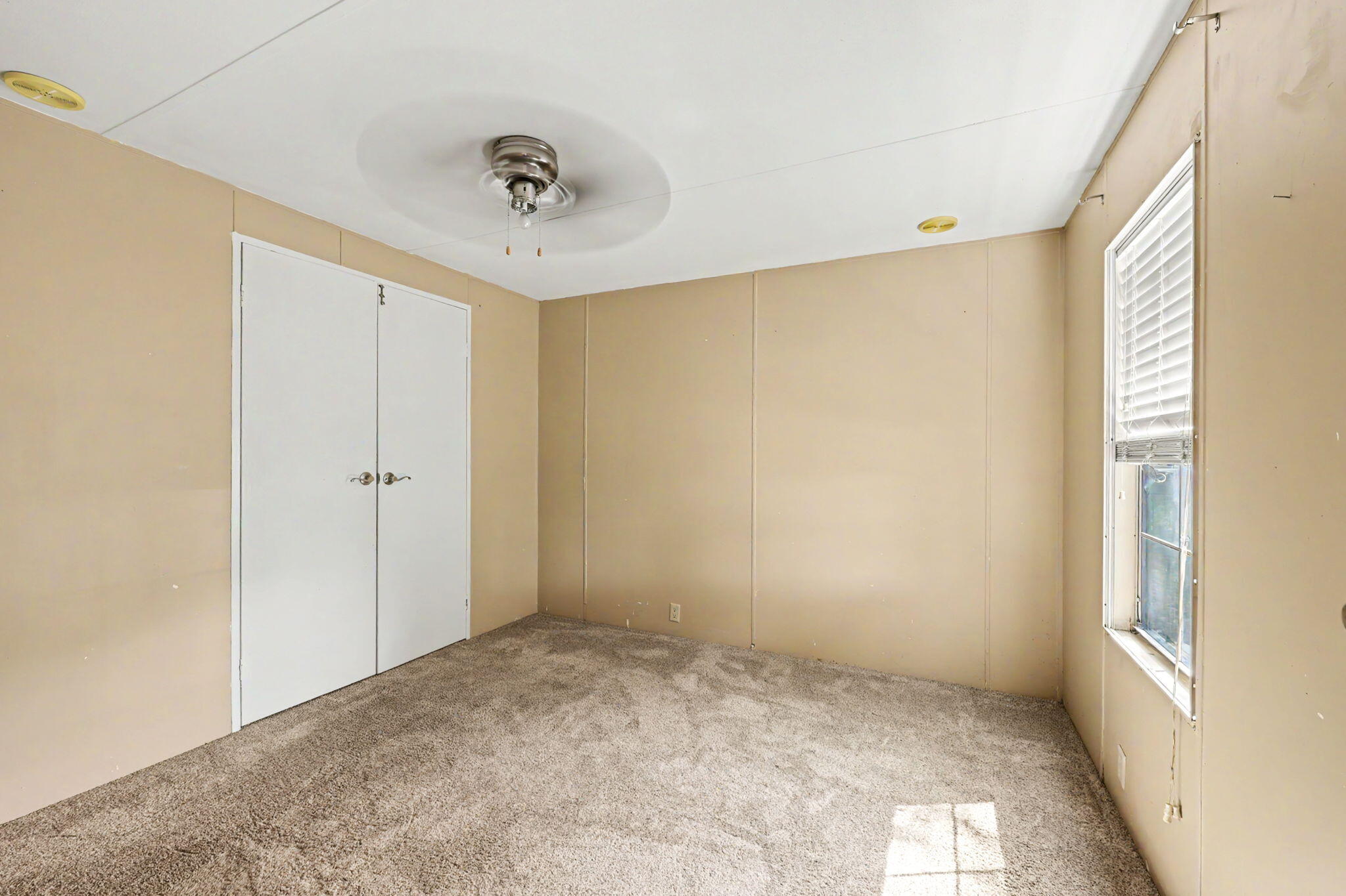 421 Stevens Road, Unit 34 Eagle Point, OR 97524 - Photo 18 of 19 a view of an empty room with a window