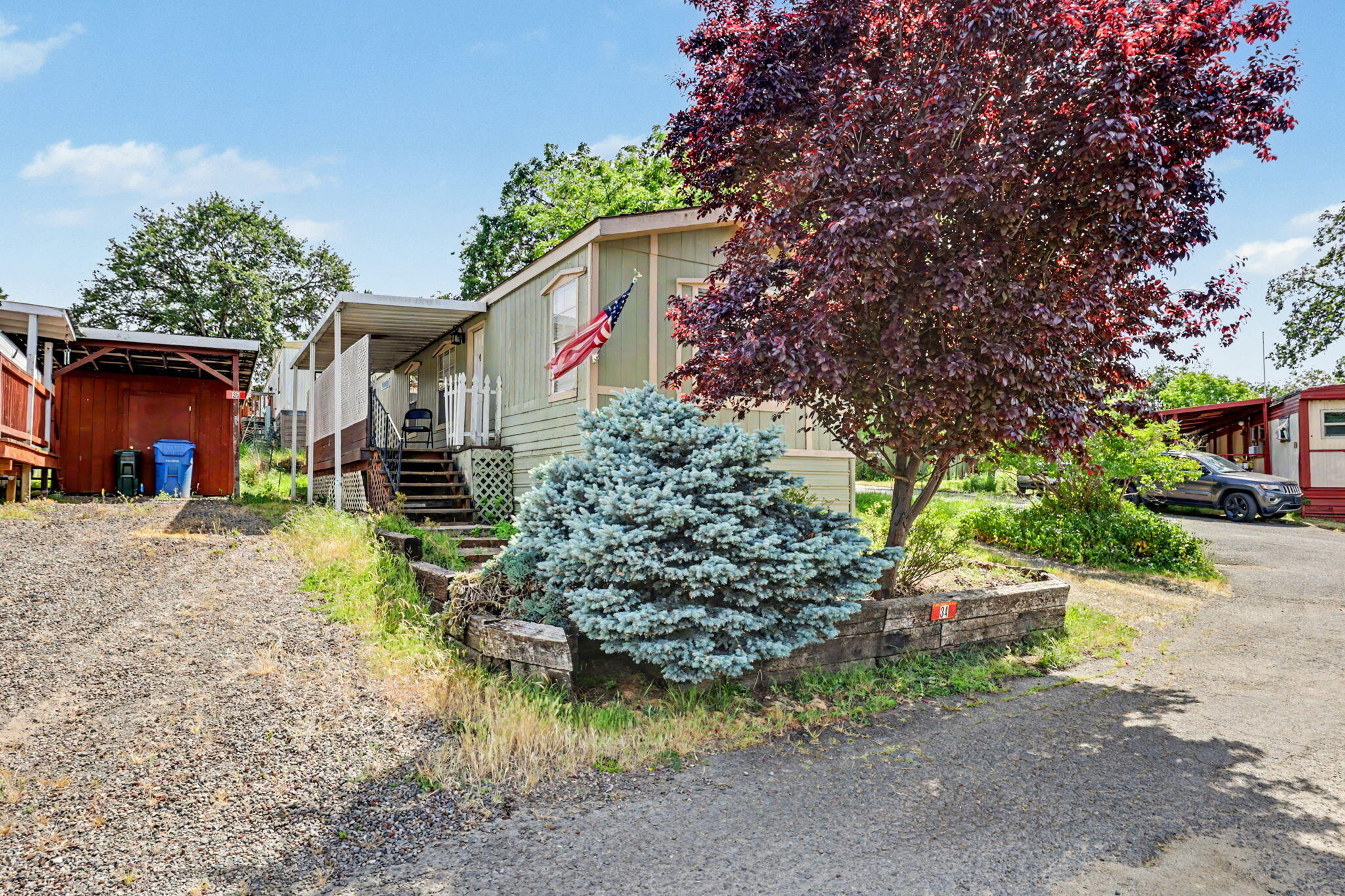 421 Stevens Road, Unit 34 Eagle Point, OR 97524 - Photo 2 of 19 front view of a house with a yard