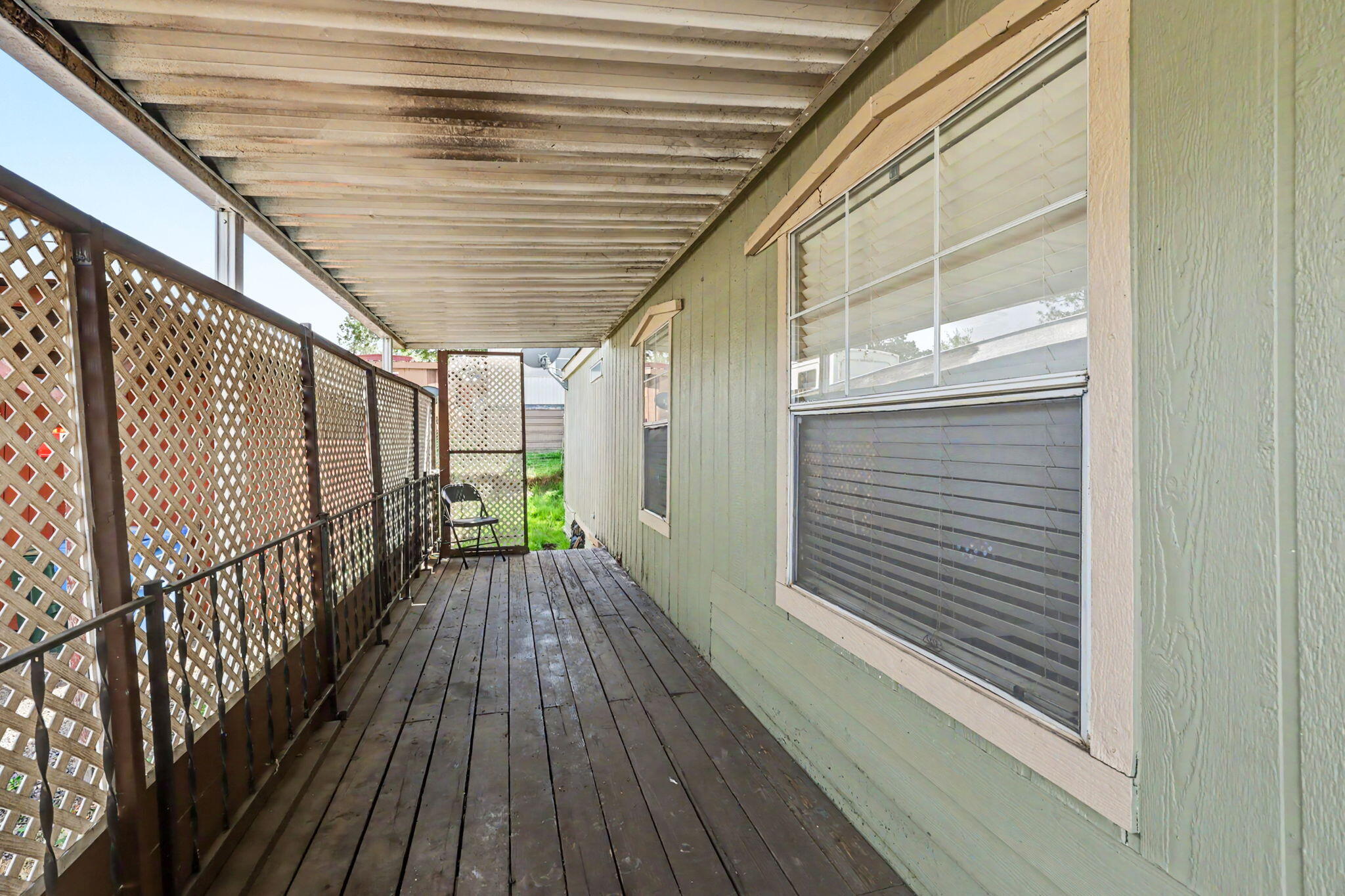 421 Stevens Road, Unit 34 Eagle Point, OR 97524 - Photo 5 of 19 a view of balcony with wooden floor