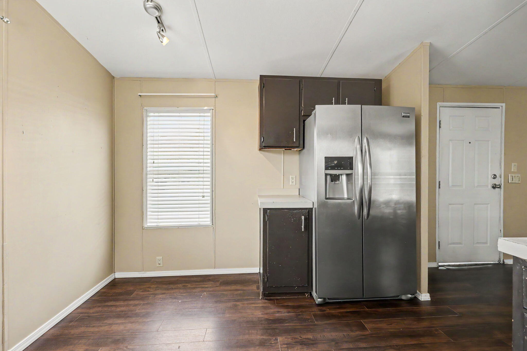 421 Stevens Road, Unit 34 Eagle Point, OR 97524 - Photo 10 of 19 a metallic refrigerator freezer sitting in a kitchen