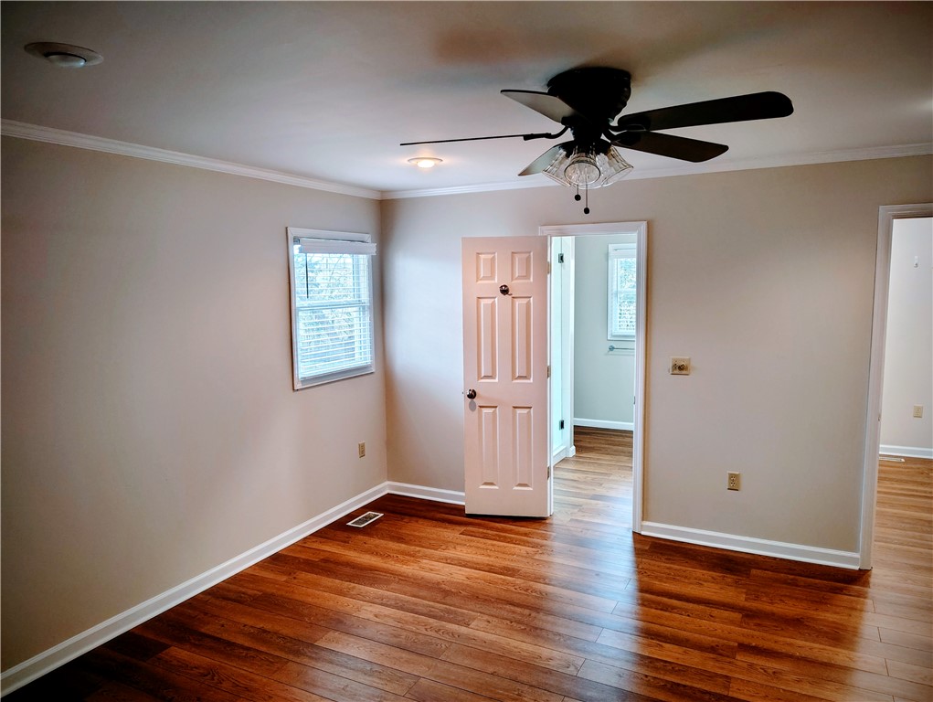 1809 Busby Road Anderson, SC 29626 - Photo 13 of 43 This airy room features rich hardwood flooring and a stylish ceiling fan for ultimate comfort.