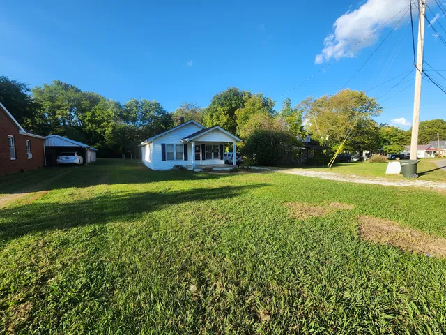a view of a house with a big yard