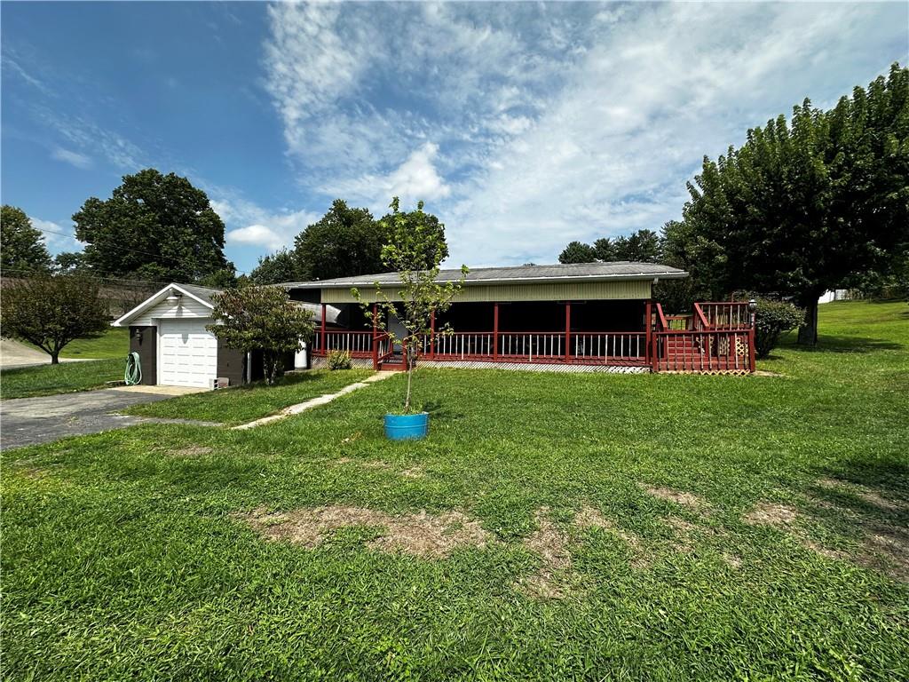 108 Francis Road Perryopolis, PA 15473 - Photo 1 of 20 a view of house with outdoor space and garden