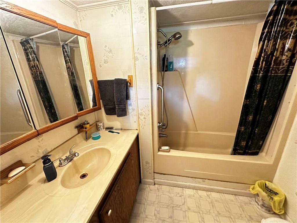 108 Francis Road Perryopolis, PA 15473 - Photo 12 of 20 a bathroom with a tub and a sink