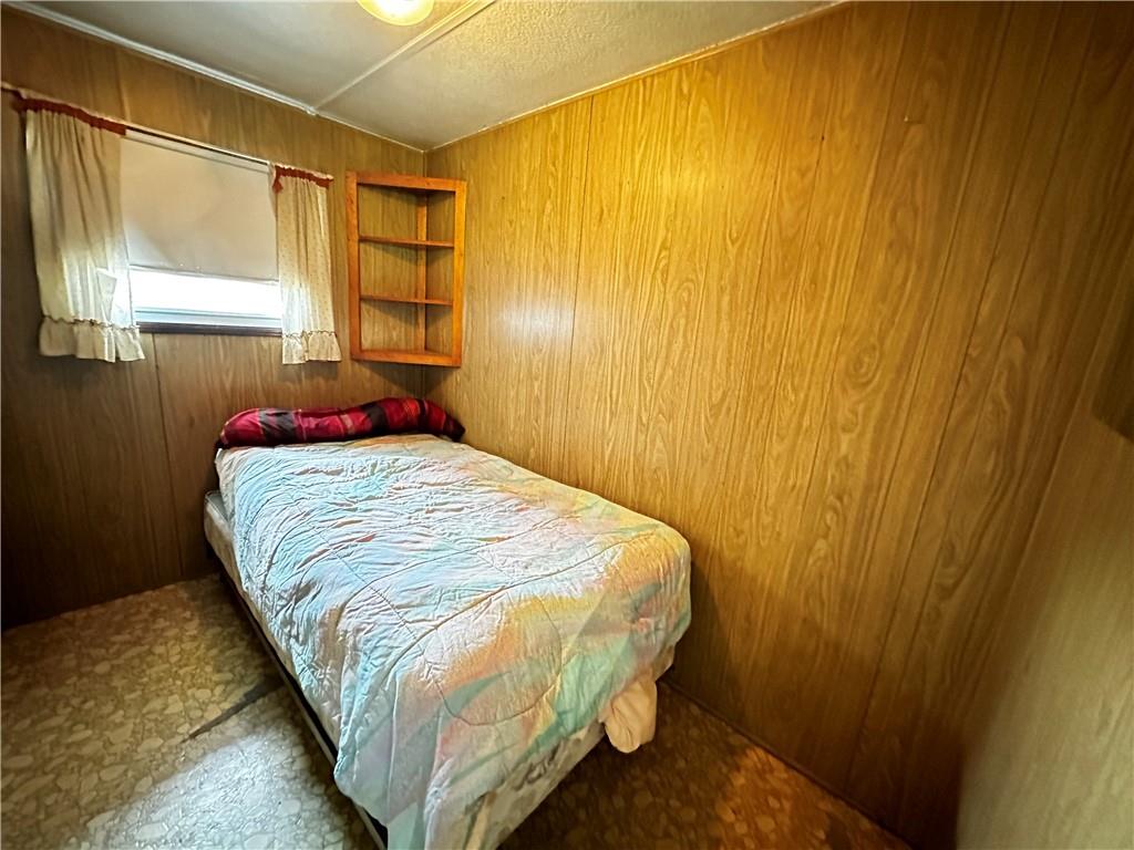 108 Francis Road Perryopolis, PA 15473 - Photo 13 of 20 a bed sitting in a bedroom next to a window