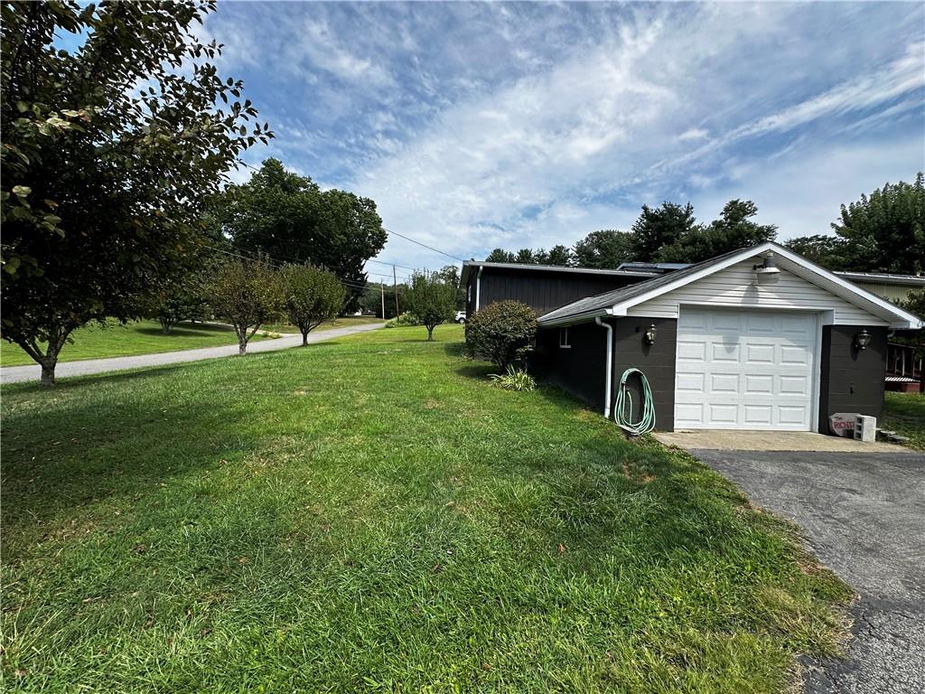 108 Francis Road Perryopolis, PA 15473 - Photo 17 of 20 a view of an house with backyard space and garden