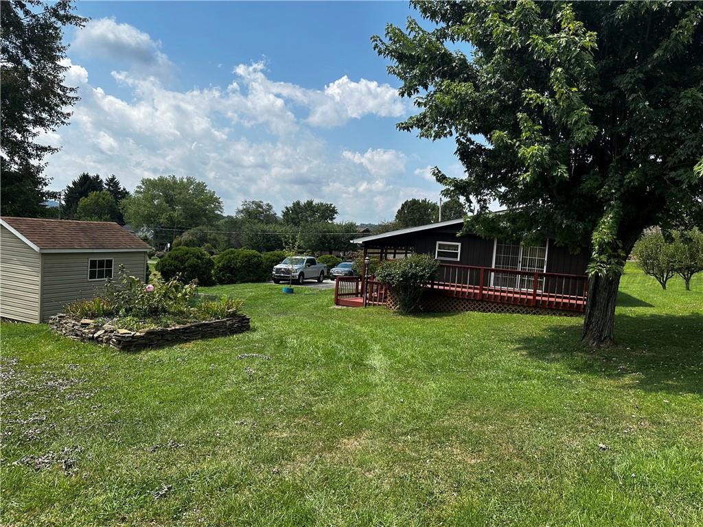 108 Francis Road Perryopolis, PA 15473 - Photo 20 of 20 a view of a house with backyard and garden