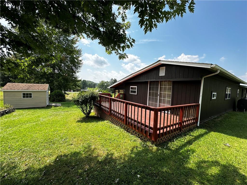 108 Francis Road Perryopolis, PA 15473 - Photo 2 of 20 a view of a garden with wooden deck