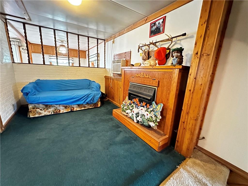 108 Francis Road Perryopolis, PA 15473 - Photo 8 of 20 a living room with furniture and a baby crib