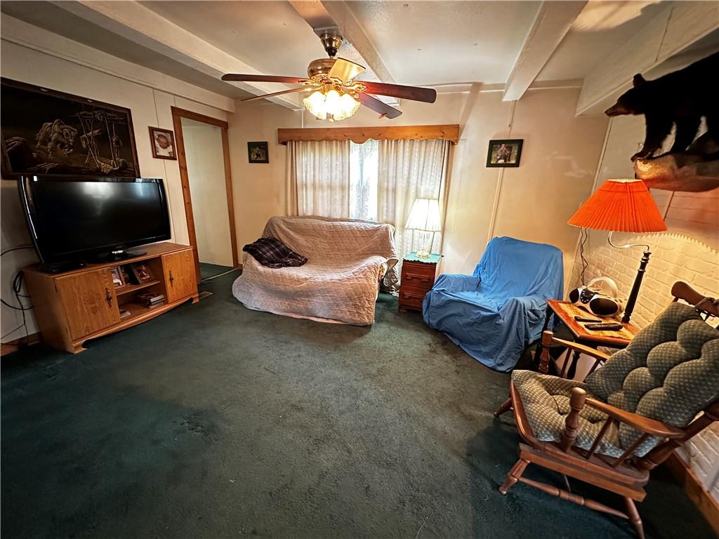 108 Francis Road Perryopolis, PA 15473 - Photo 9 of 20 a living room with furniture a flat screen tv and a window