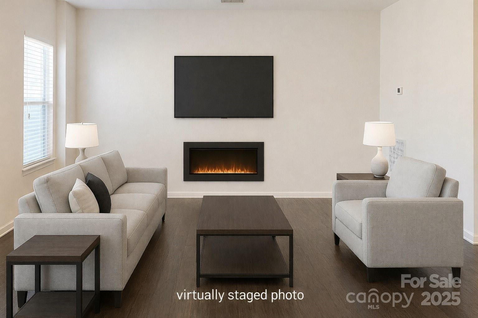 11044 Telegraph Road Northwest Concord, NC 28027 - Photo 11 of 25 a living room with furniture a flat screen tv and a fireplace