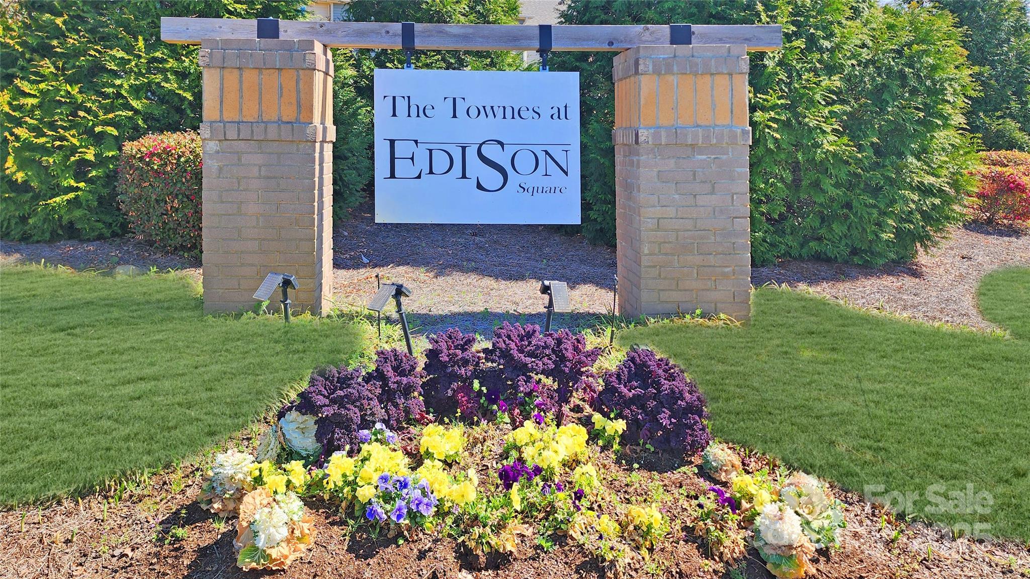 11044 Telegraph Road Northwest Concord, NC 28027 - Photo 2 of 25 a sign that is in front of flowers