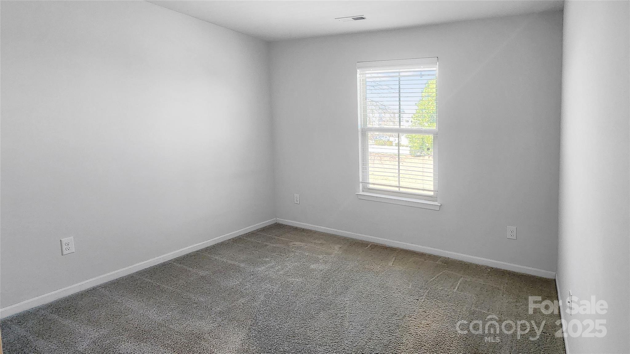 11044 Telegraph Road Northwest Concord, NC 28027 - Photo 21 of 25 an empty room with a window