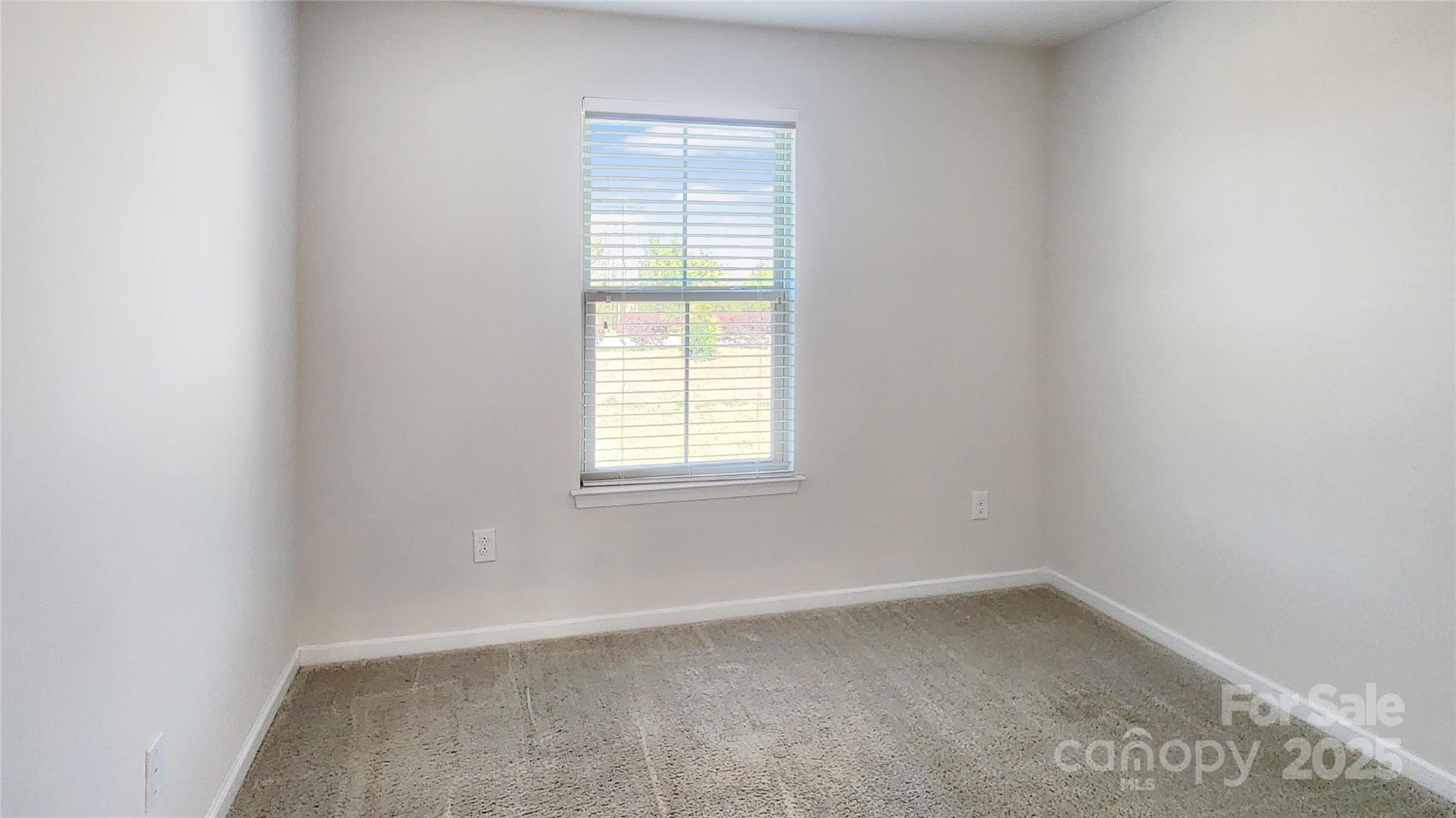 11044 Telegraph Road Northwest Concord, NC 28027 - Photo 22 of 25 an empty room with a window