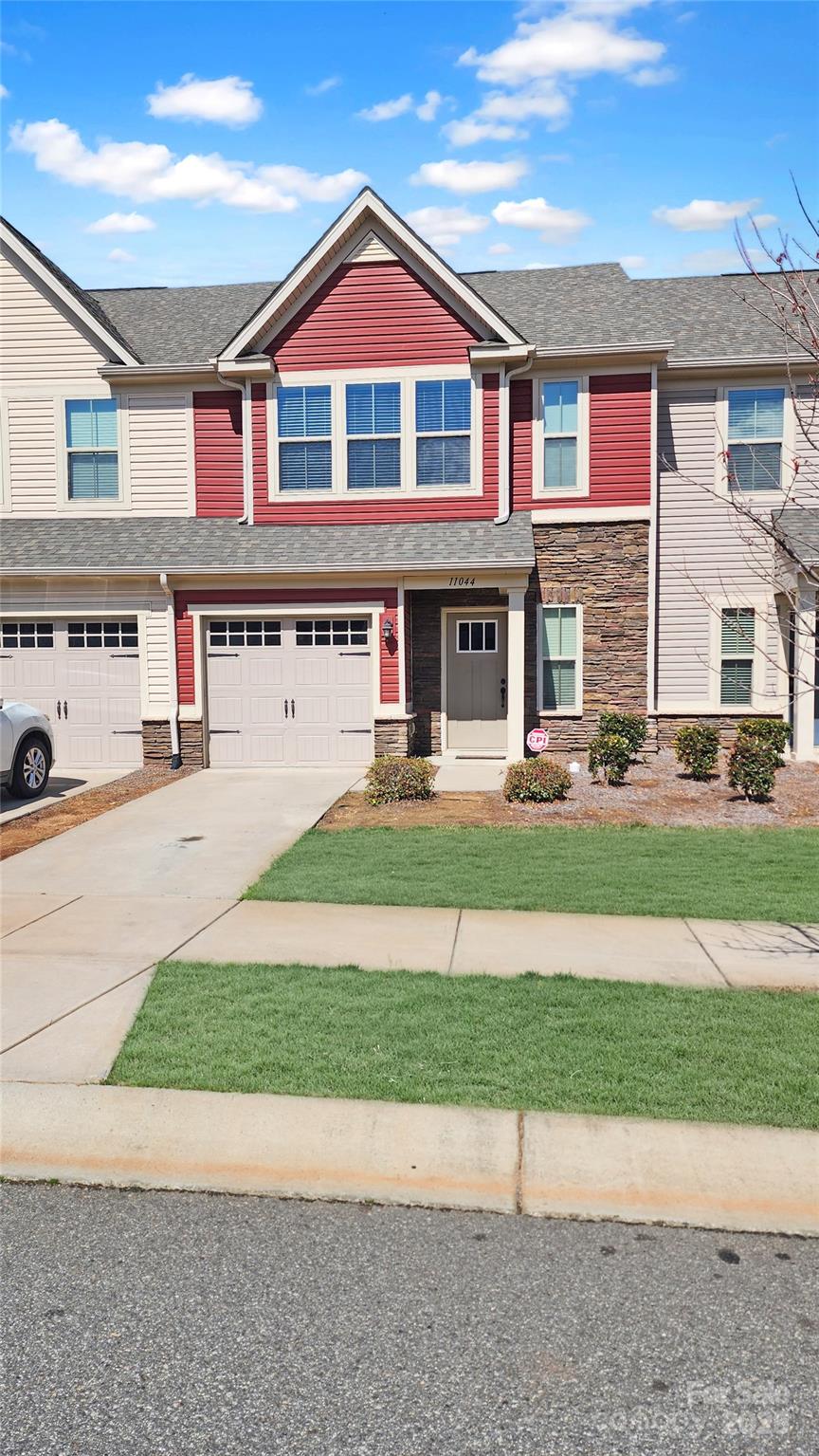 11044 Telegraph Road Northwest Concord, NC 28027 - Photo 3 of 25 a front view of a house with a yard