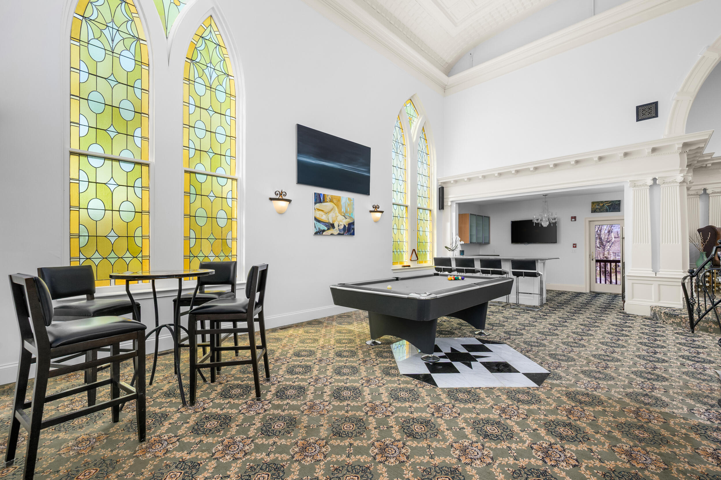 143 Main Street Sandwich, MA 02563 - Photo 12 of 39 a living room with furniture a flat screen tv and a large window