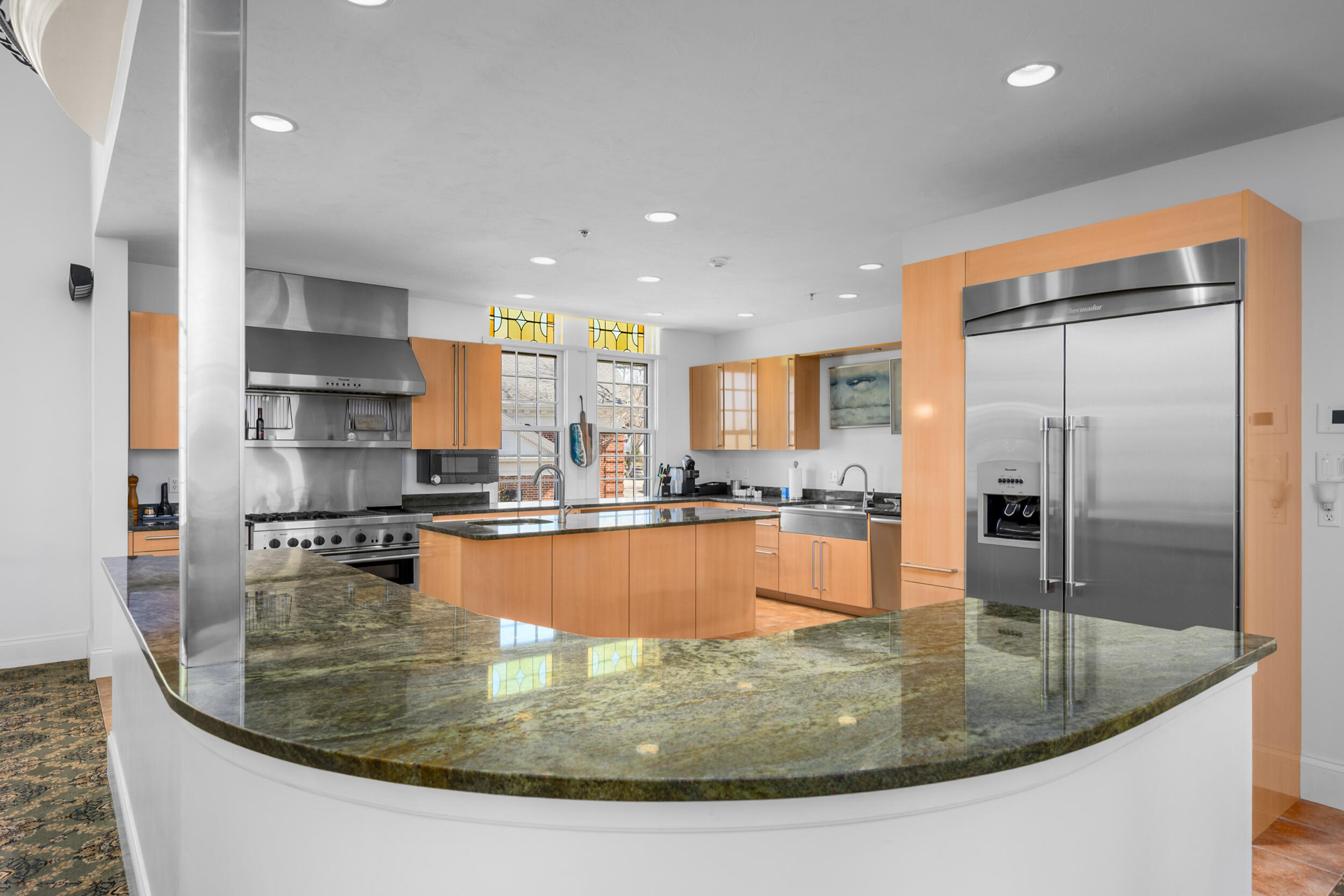 143 Main Street Sandwich, MA 02563 - Photo 21 of 39 a view or kitchen with stainless steel appliances granite countertop a sink a stove and a refrigerator