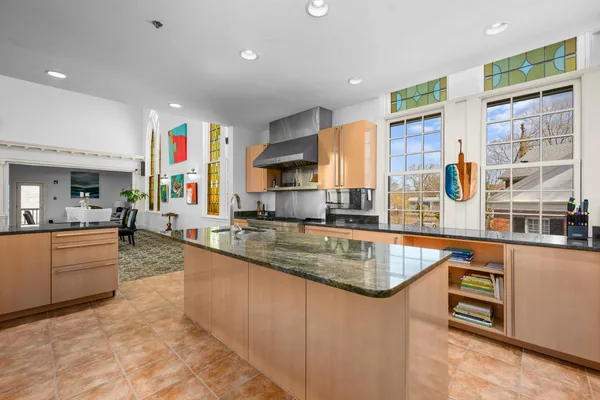 a dining room with furniture a rug and a window