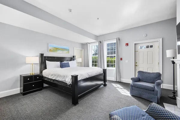 a bedroom with a bed and a couch