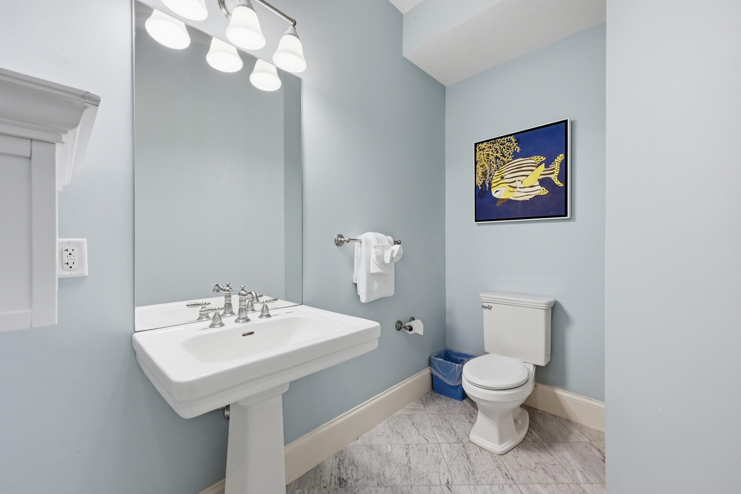 143 Main Street Sandwich, MA 02563 - Photo 30 of 39 a white toilet sitting next to a bathroom sink