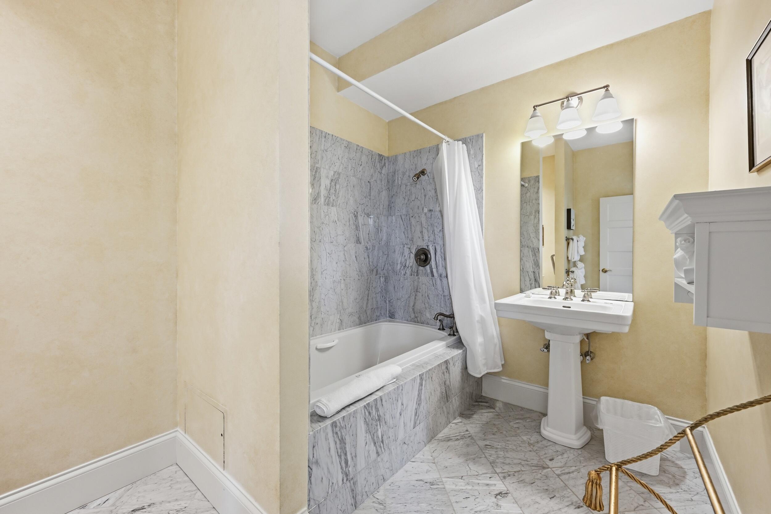 143 Main Street Sandwich, MA 02563 - Photo 32 of 39 a bathroom with a sink a toilet and shower