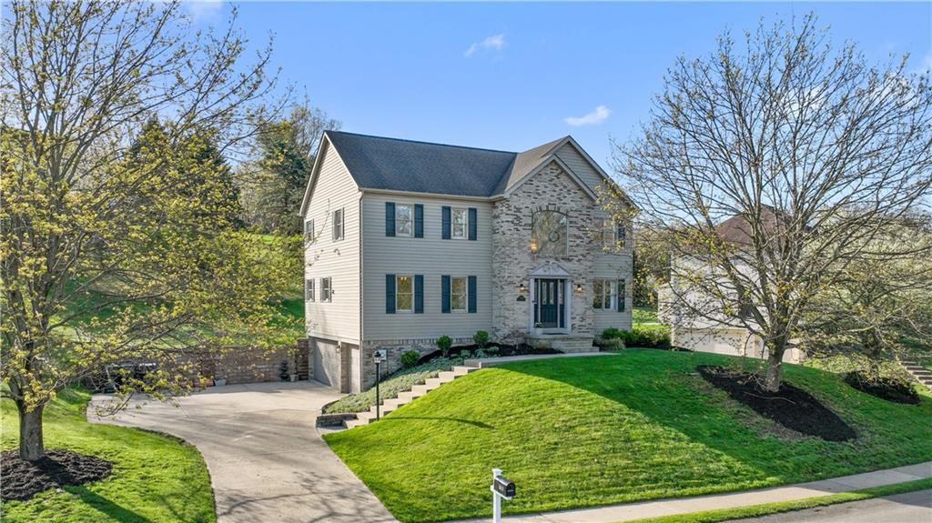 3018 White Pine Drive Gibsonia, PA 15044 - Photo 1 of 38 a front view of a house with a garden