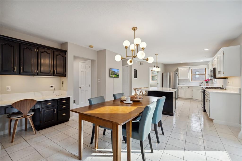 3018 White Pine Drive Gibsonia, PA 15044 - Photo 11 of 38 a view of a dining room with furniture and chandelier