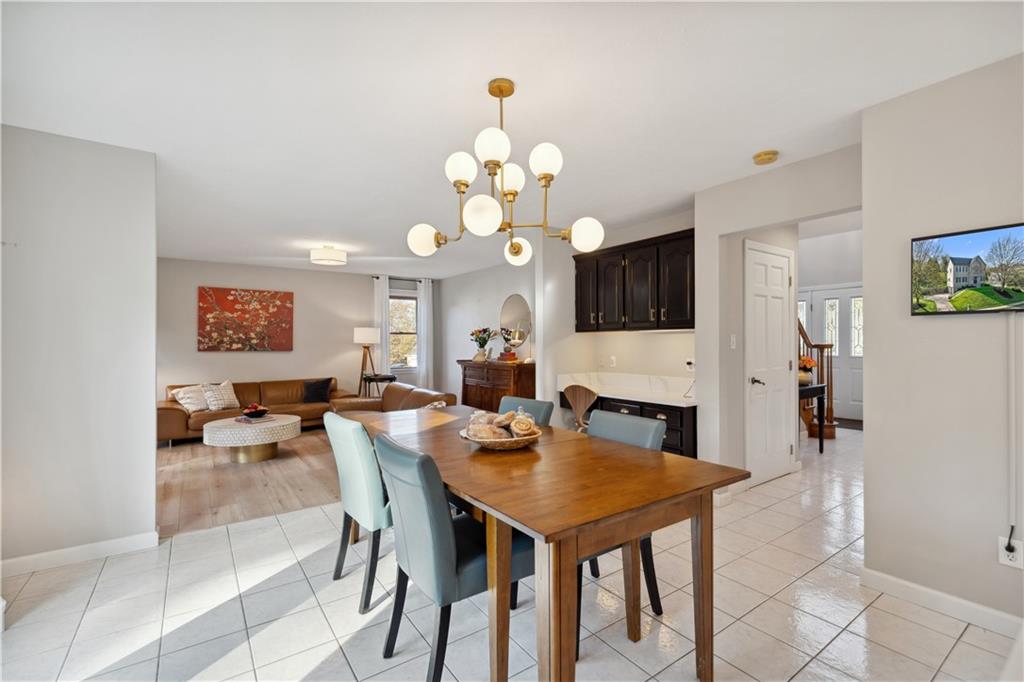 3018 White Pine Drive Gibsonia, PA 15044 - Photo 13 of 38 a view of a dining room with furniture and a chandelier