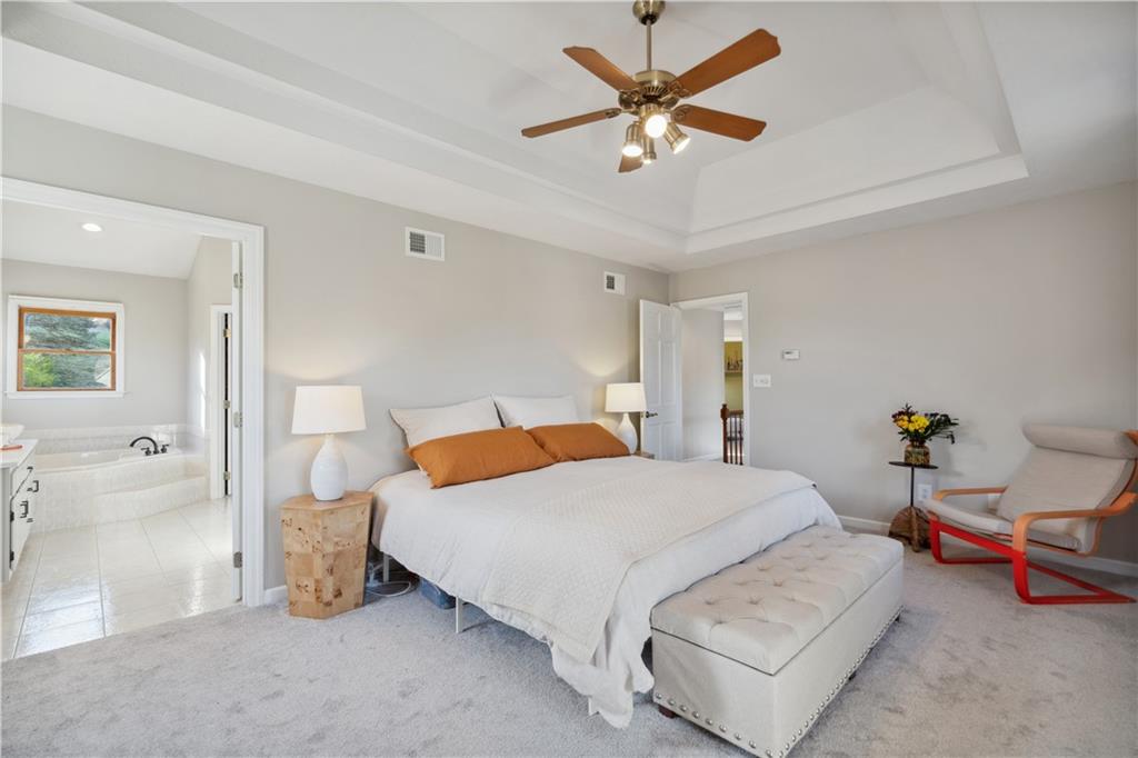 3018 White Pine Drive Gibsonia, PA 15044 - Photo 18 of 38 a bedroom with a bed and a chandelier