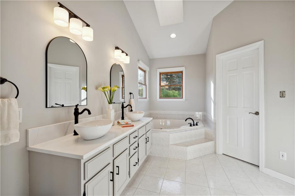 3018 White Pine Drive Gibsonia, PA 15044 - Photo 19 of 38 a spacious bathroom with a double vanity sink mirror and bathtub