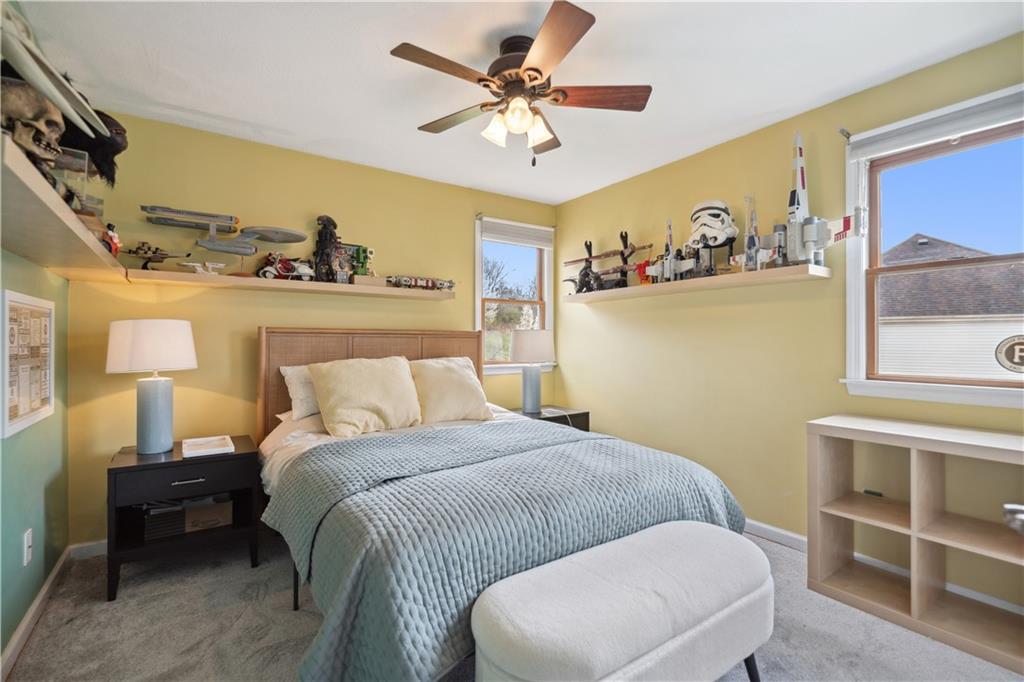 3018 White Pine Drive Gibsonia, PA 15044 - Photo 22 of 38 a bedroom with a bed and a table in it