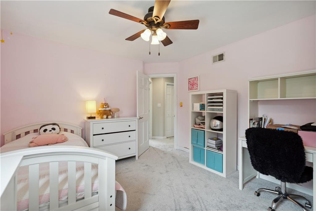 3018 White Pine Drive Gibsonia, PA 15044 - Photo 27 of 38 a bedroom with a bed and cabinets
