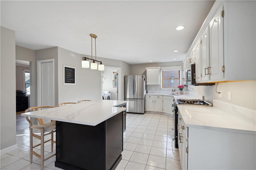 3018 White Pine Drive Gibsonia, PA 15044 - Photo 8 of 38 a kitchen with a sink refrigerator and cabinets