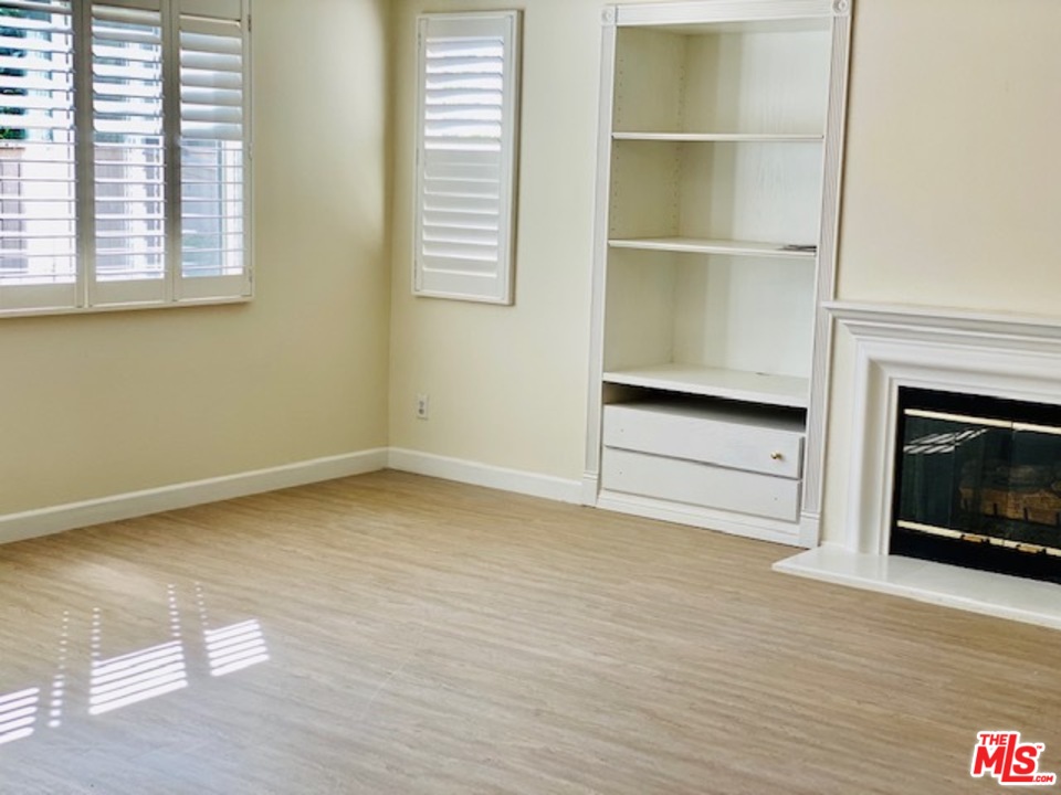 16 Nebraska Irvine, CA 92606 - Photo 12 of 18 a view of an empty room with a fireplace and a window
