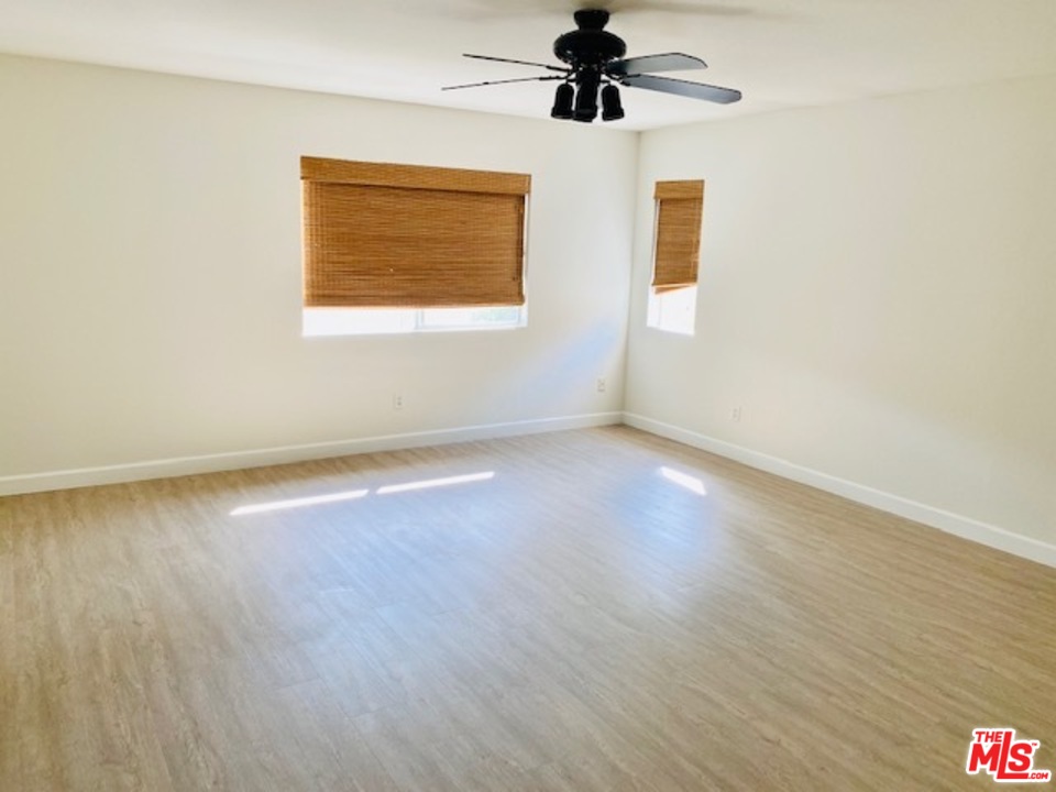 16 Nebraska Irvine, CA 92606 - Photo 15 of 18 a view of an empty room with wooden floor and a window