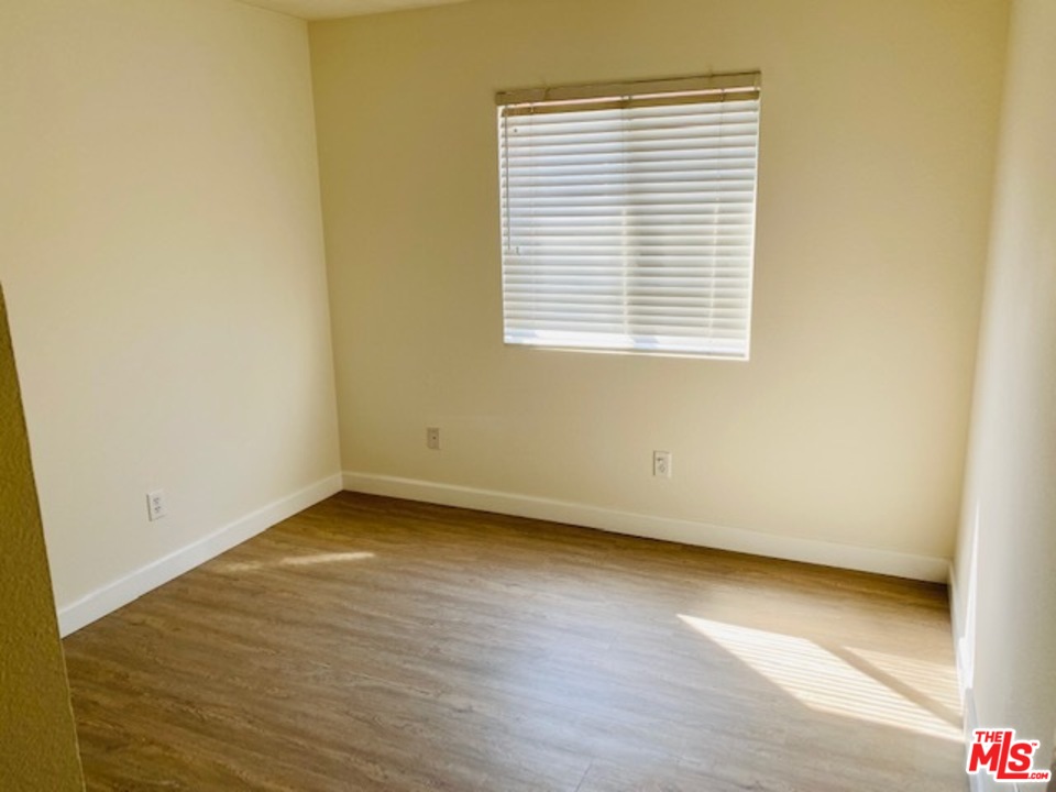 16 Nebraska Irvine, CA 92606 - Photo 16 of 18 an empty room with wooden floor and a window