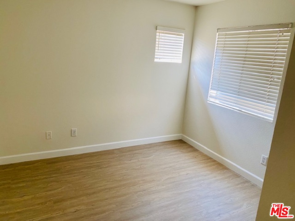 16 Nebraska Irvine, CA 92606 - Photo 17 of 18 a view of an empty room with wooden floor and a window