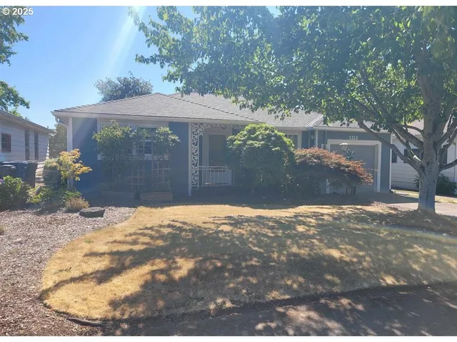 a view of a backyard of the house
