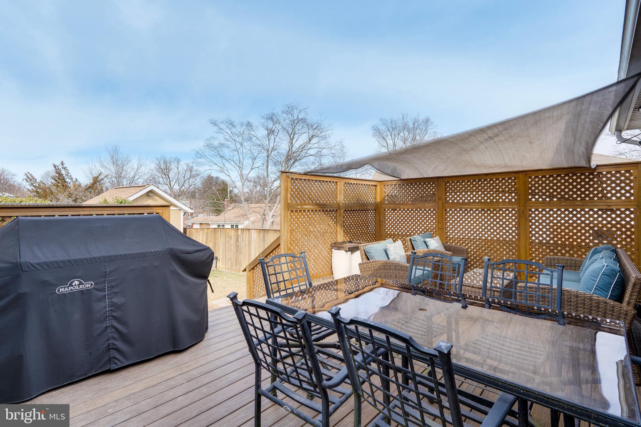 3707 Everton Street Silver Spring, MD 20906 - Photo 21 of 52 a view of a patio with table and chairs with wooden floor