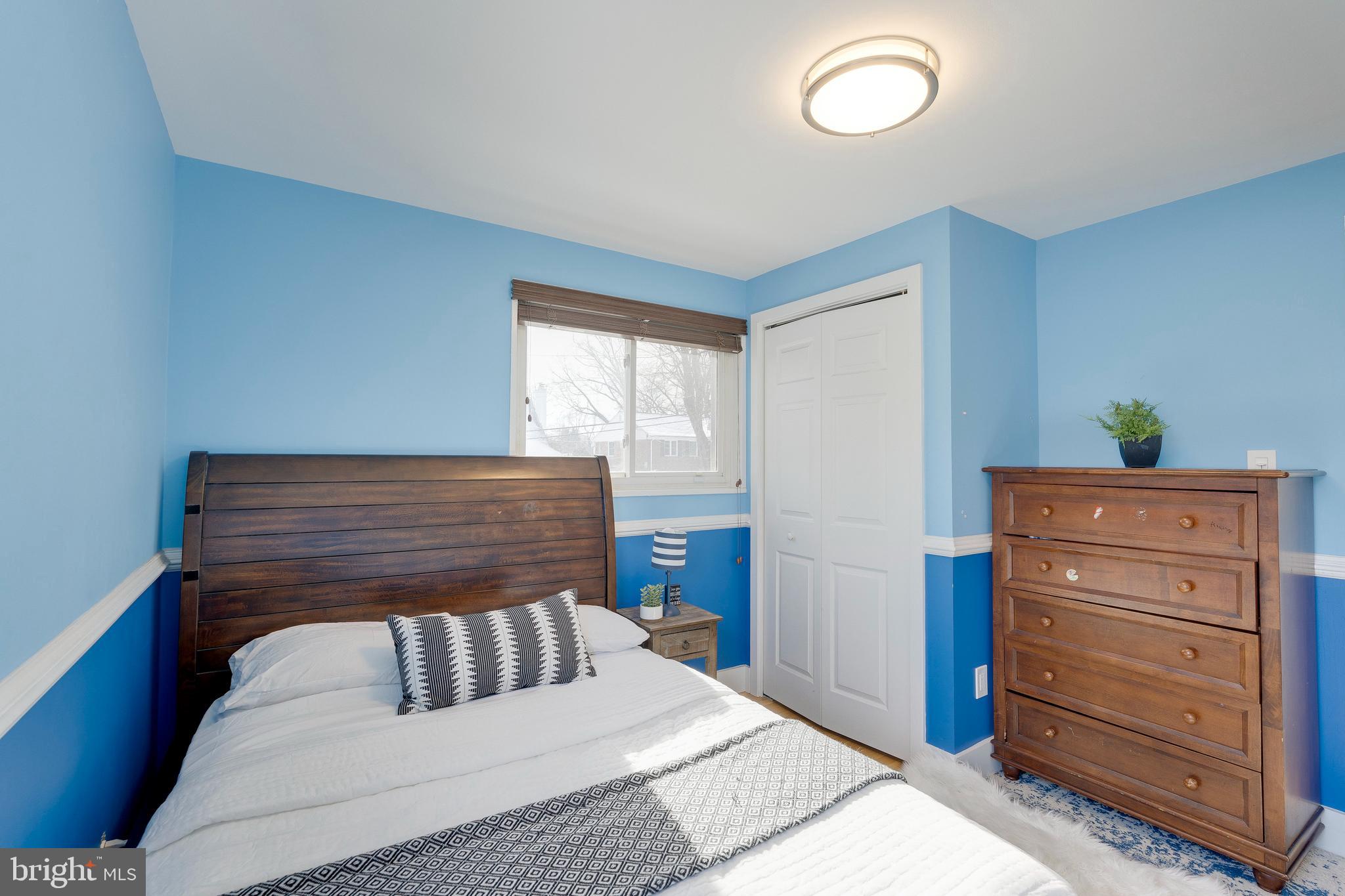 3707 Everton Street Silver Spring, MD 20906 - Photo 30 of 52 a bedroom with a bed and cabinet