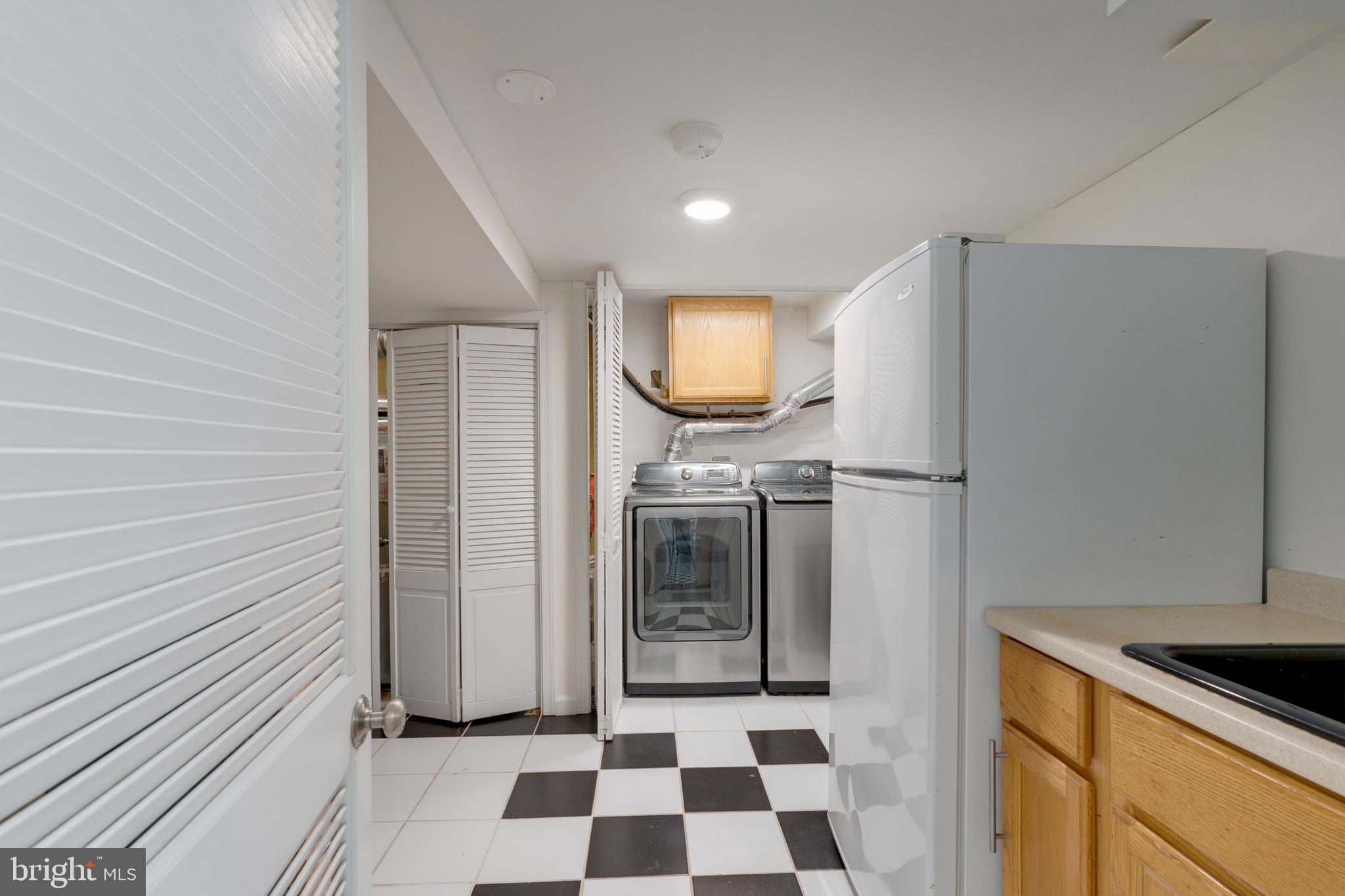 3707 Everton Street Silver Spring, MD 20906 - Photo 41 of 52 a kitchen with stainless steel appliances granite countertop a refrigerator a stove and a sink
