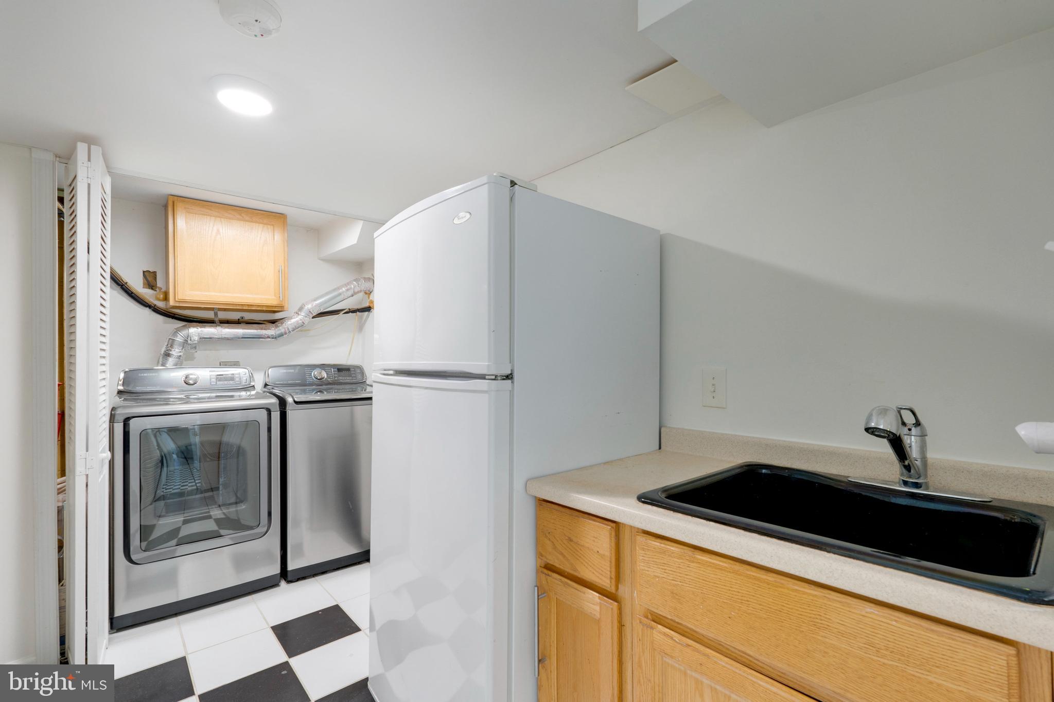 3707 Everton Street Silver Spring, MD 20906 - Photo 42 of 52 a kitchen with a refrigerator and a sink