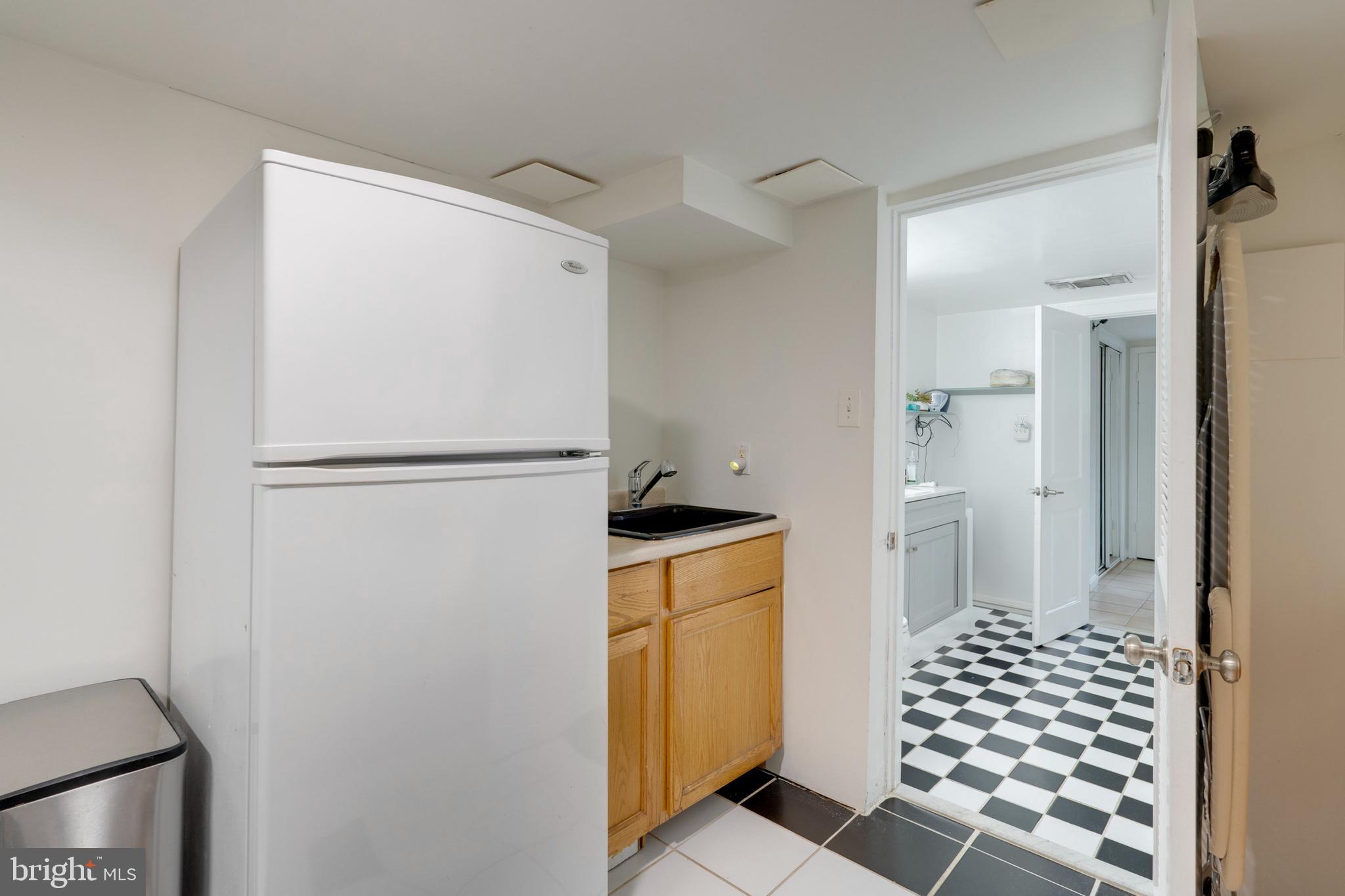 3707 Everton Street Silver Spring, MD 20906 - Photo 43 of 52 a kitchen with a refrigerator and a stove top oven