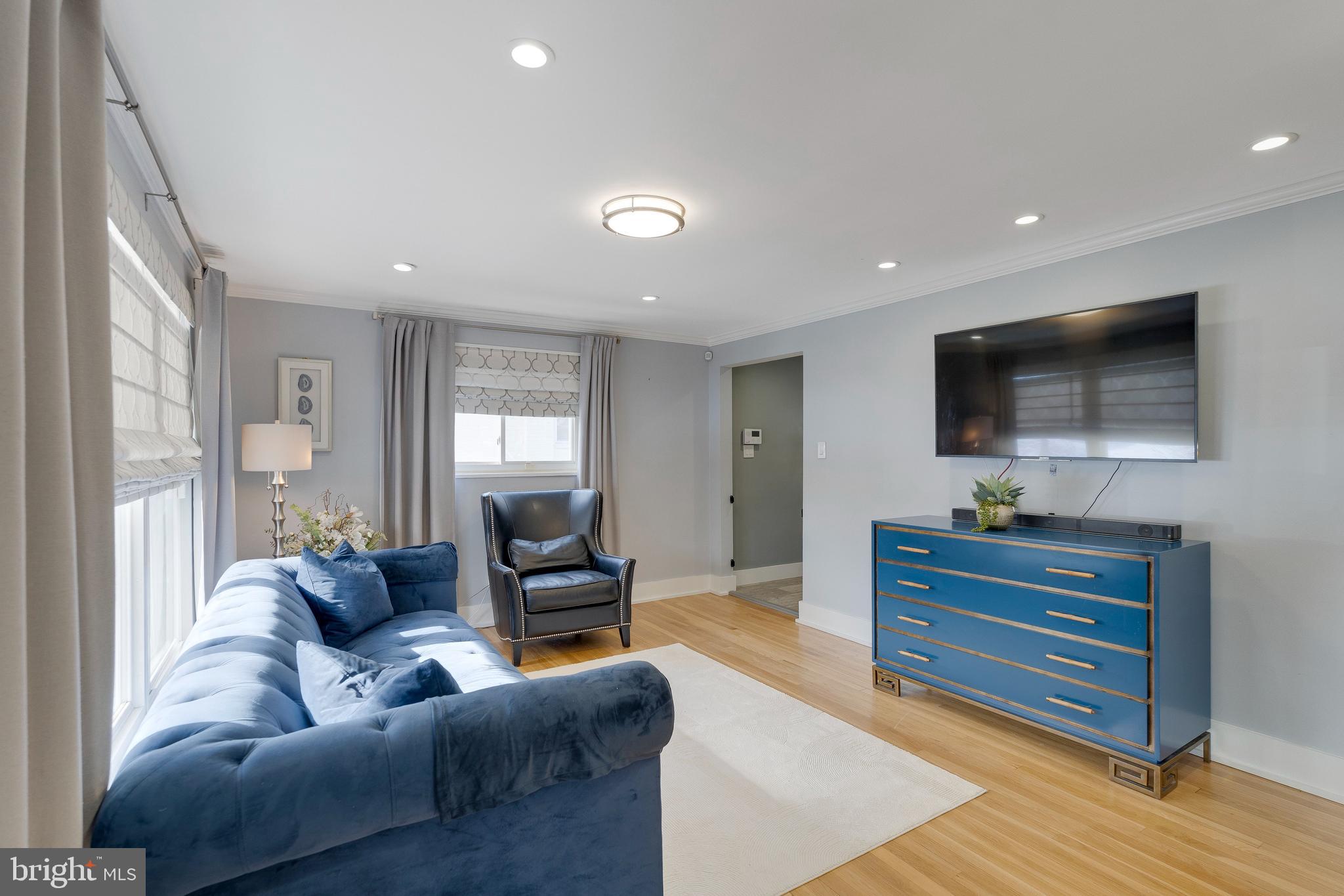 3707 Everton Street Silver Spring, MD 20906 - Photo 8 of 52 a living room with furniture and a flat screen tv