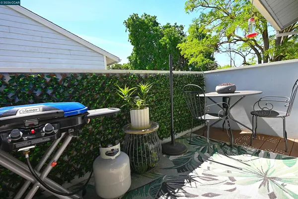 a view of a chairs and table in the patio