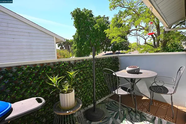 a view of a chairs and table in patio