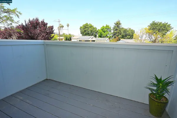 a swimming pool with outdoor seating and yard