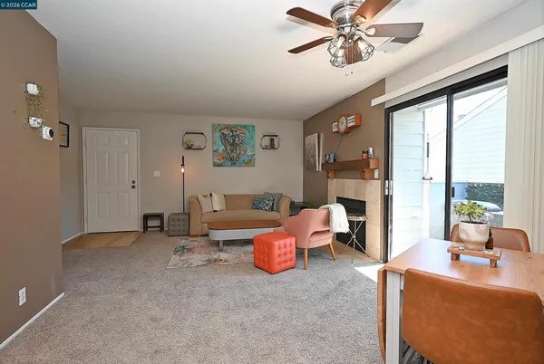 a living room with furniture and a large window